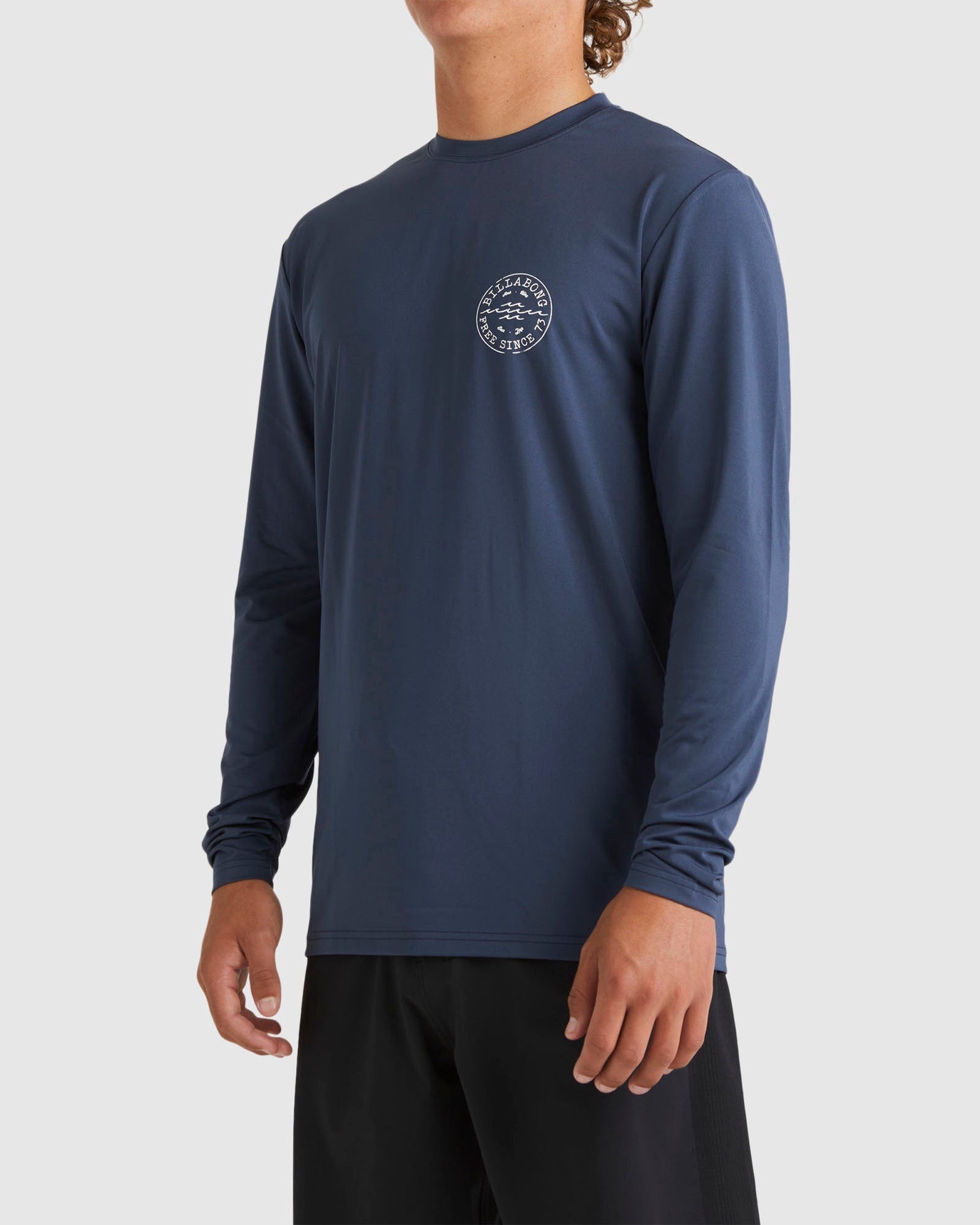 Billabong | Big Wave Daz Loose Fit 50+ UPF Long Sleeve Rashguard. Dusty Navy